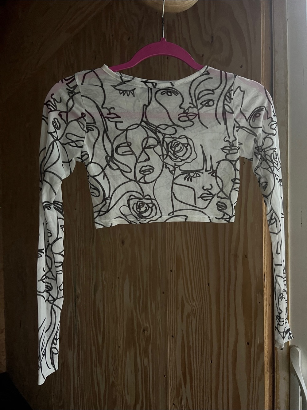 PrettyLittleThing White Cropped Long Sleeve Top with Black Abstract Face Print